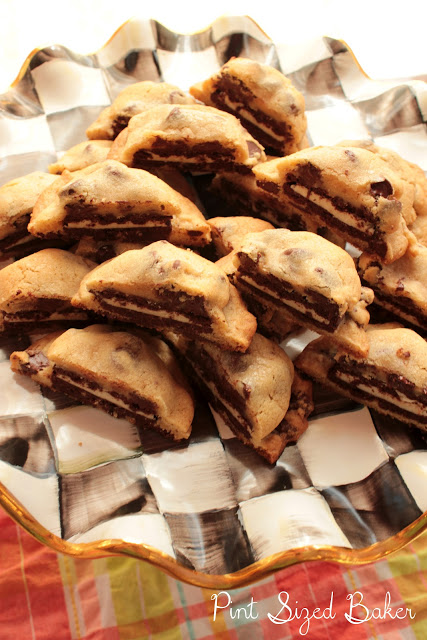 An image of a serving tray full of Oreo stuffed chocolate chip cookies cut in half so you can see the insides.