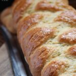 This homemade Challah recipe makes enough for 4 loaves. Enjoy a loaf in your Baked French Toast.