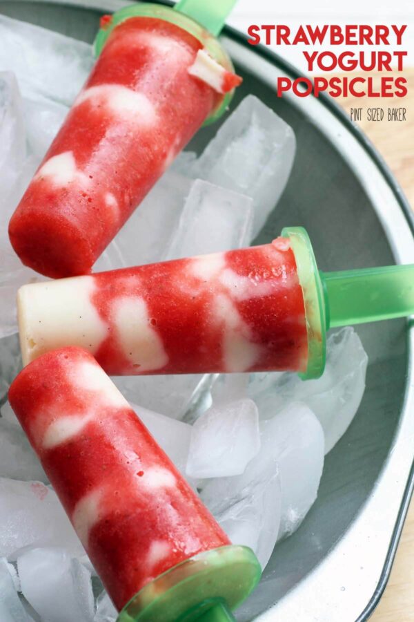 Grab the kids and have them help you make these easy and delicious Strawberry and Yogurt Popsicles. So easy, so fun, and so perfect for a hot day!