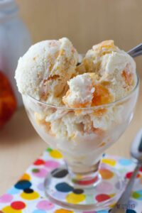 A simple vanilla ice cream with a ribbon of peach puree throughout. Peaches and Cream Ice Cream is a summer Must!