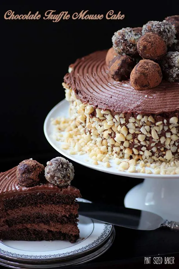 A Chocolate Lovers utopia. This chocolate mousse cake with truffles on top is just what the doctor ordered. It's perfect for a decadent dessert!
