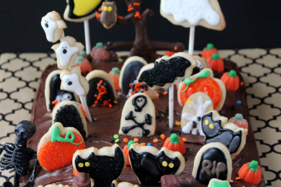 The kids are going to LOVE baking, decorating, and creating this fun Graveyard Cake for Halloween! Cookie decoration on a sheet cake!