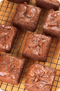 Delicious brownies baked in a square pan for perfectly square slices.
