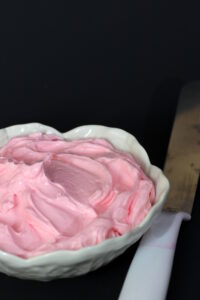 The perfect pink Swiss Buttercream Frosting for a perfect girly cake!
