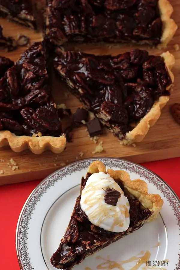 Sweet and easy - this chocolate butterscotch pecan tart with soft whipped cream and butterscotch drizzle. It's a perfect dessert.