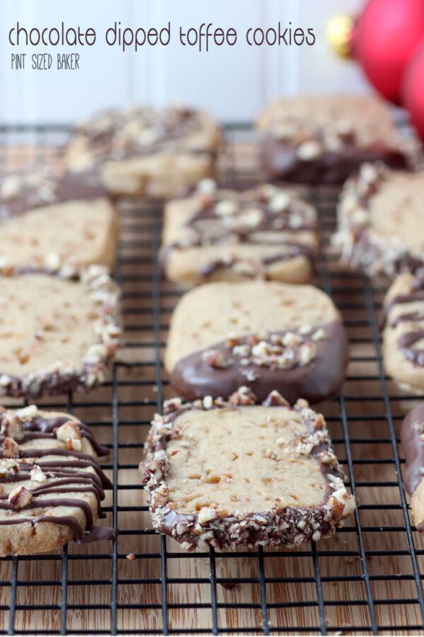 Delicious Chocolate dipped toffee cookies are great for any day! Easy to slice, bake and dip. These go great with and sweet, holiday drinks!