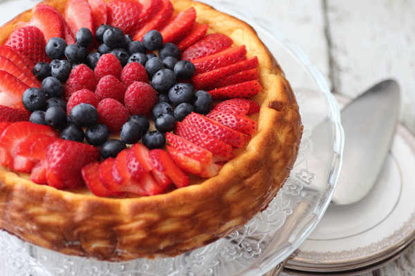 Lemon Ricotta Cheesecake with mixed berries and chocolate syrup. from #dietersdownfall.com