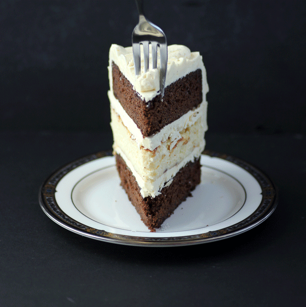 Three layers of deliciousness. Devil's Food Cake and Ricotta Cheesecake with Vanilla Bean buttercream. from #dietersdownfall.com