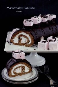 Decadent Marshmallow Roulade. A Roll Cake with seven minute frosting and topped with homemade marshmallows.