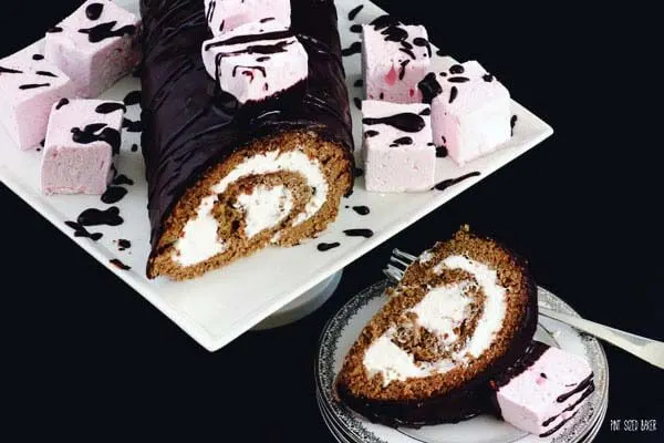 Decadent Marshmallow Roulade. A Roll Cake with seven minute frosting and topped with homemade marshmallows.