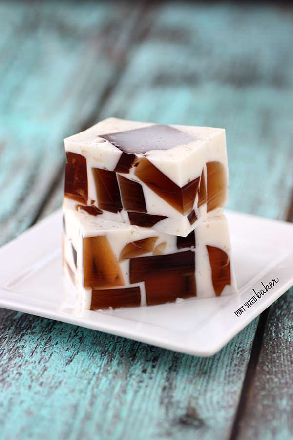 Two cubes of root beer Jello on a plate