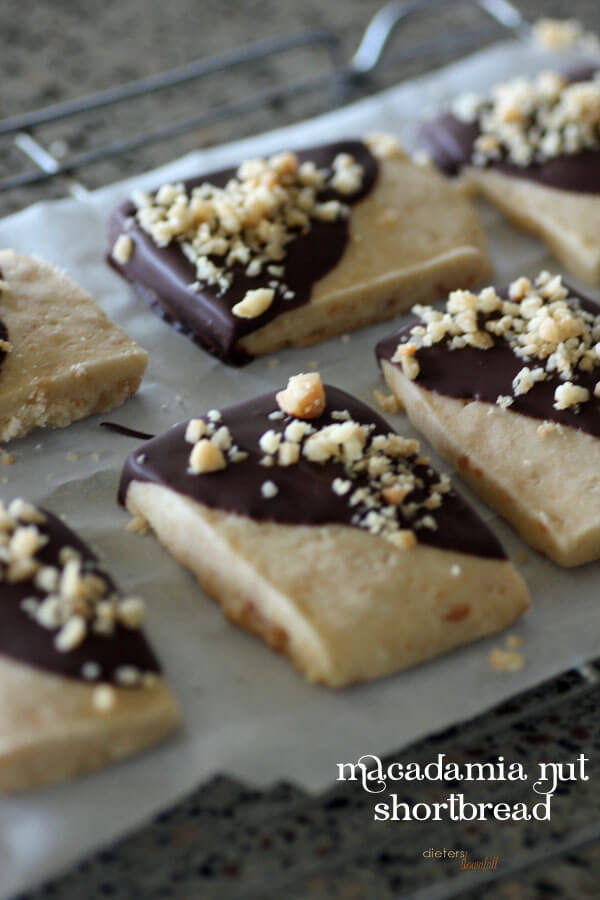 An image linking to my Macadamia Nut Shortbread Cookie recipe dipped in chocolate.