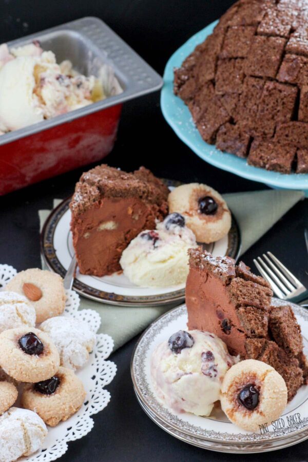 Chocolate Zuccotto (bomb cake) with a light spongy cake exterior and filled with chocolate mousse and cherries served with Buttermilk Ice Cream and Amaretti Cookies.