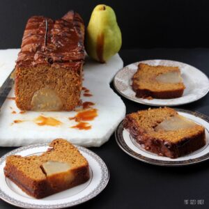 An easy pumpkin quick bread baked with poached pears inside! Get your holiday baking done with this delicious bread!