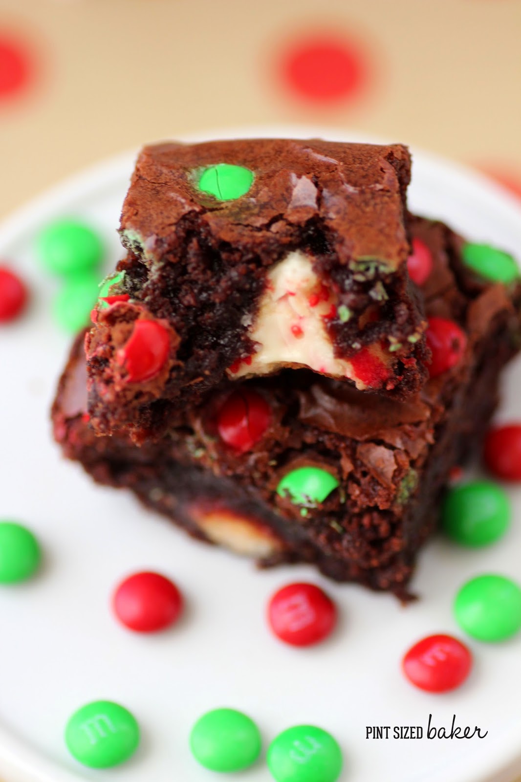 The Christmas season calls for these Candy Cane Kisses Brownies that are stuffed with a kiss and topped with mini M&Ms. Perfect for the kids!