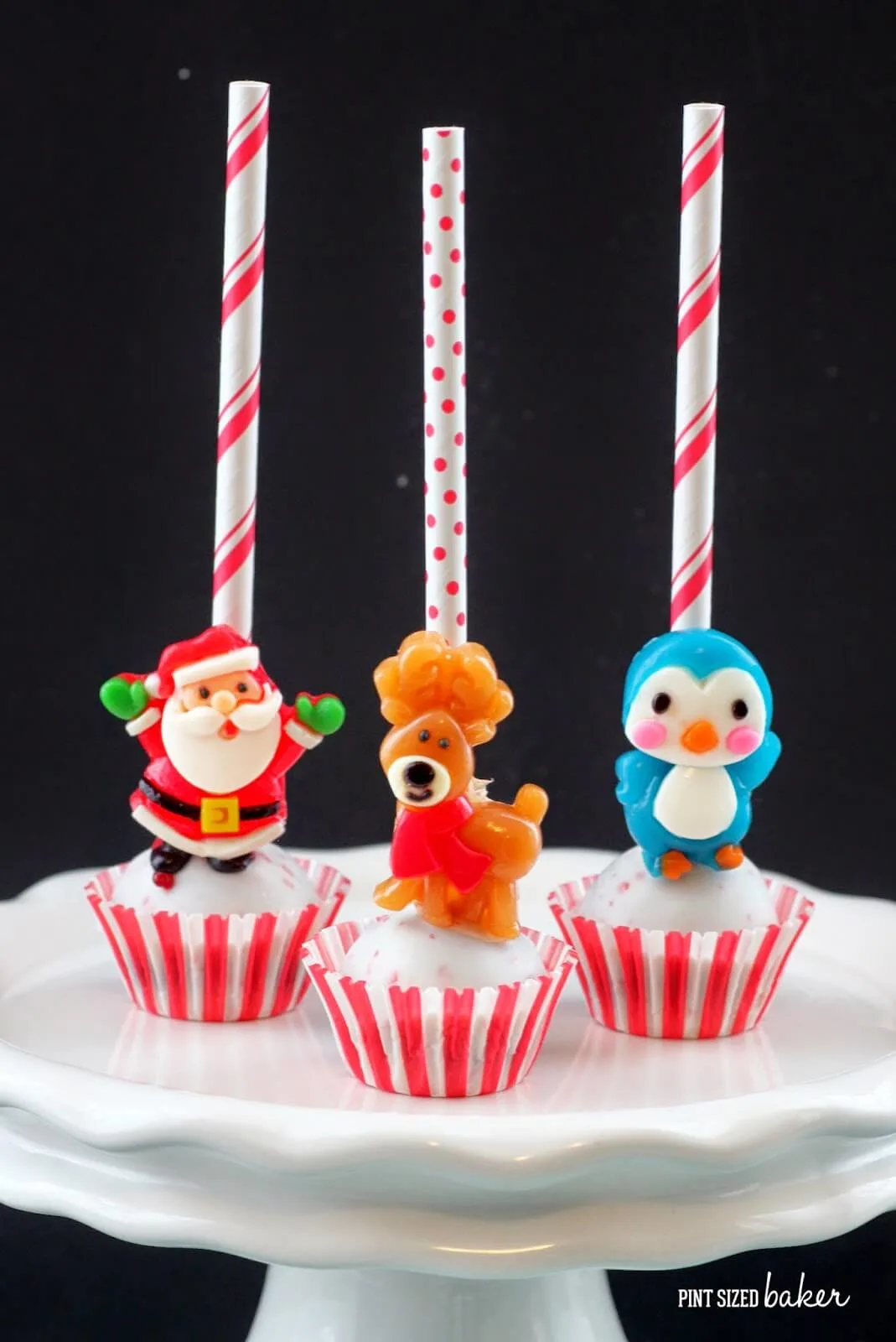 These Easy Christmas Cake Pops are so simple to make and look so adorable! Pick up the gummy candies at the store and make them for your holiday party.
