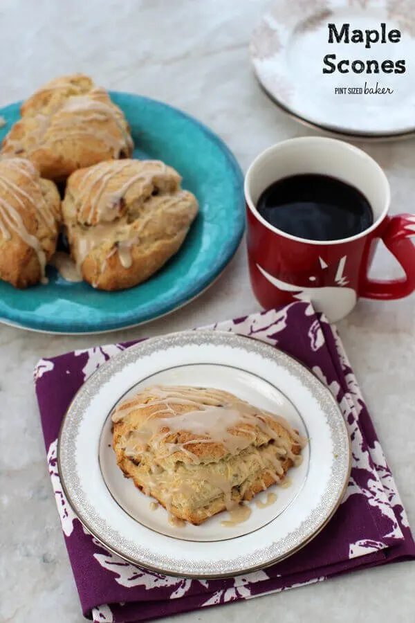 Maple Scones on a small plate with a cup of coffee.