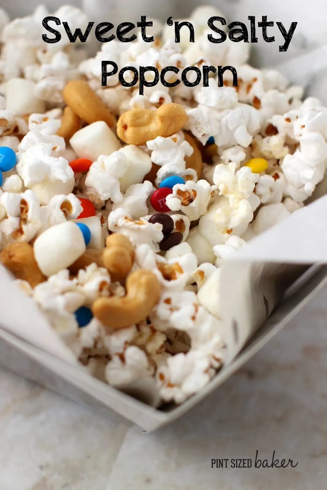 Enjoy some Sweet and Salty popcorn with mini M&M's, mini marshmallows and some salty cashews.
