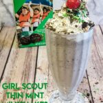 Enjoy a large Thin Mint Girl Scout Cookie Milkshake with whipped cream, sprinkles, and a cherry on top!