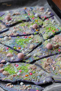 Beautiful Candy Bark decorated with a mixture of sprinkles and Strawberry Whoppers. All ready for a birthday cake!