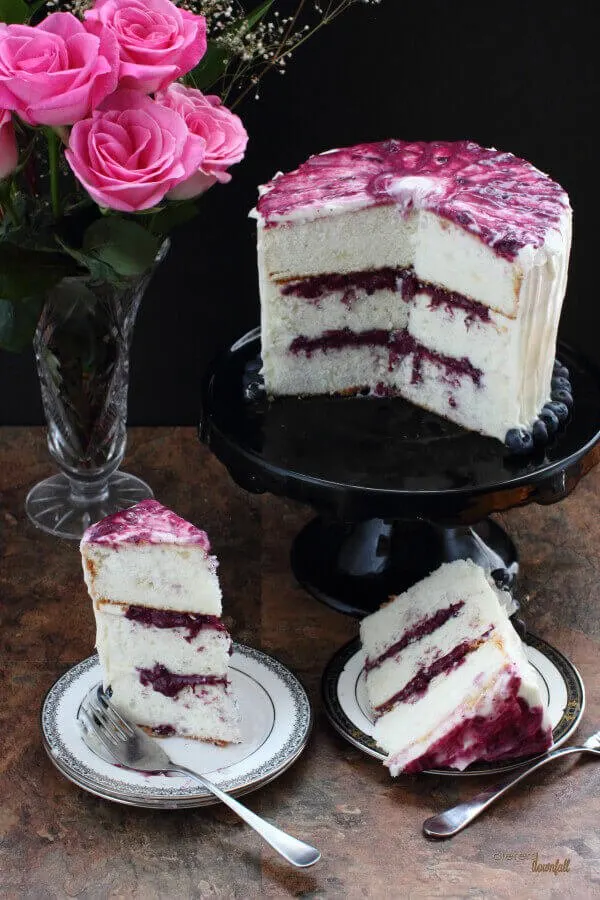 A beautiful cake filled with blueberry and walnut curd and topped with an orange cream cheese frosting.