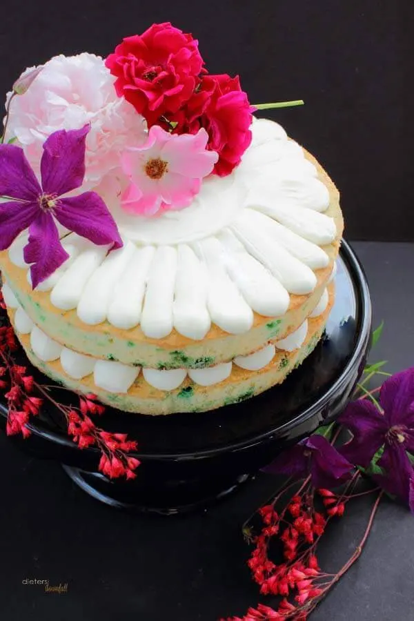 Fresh Flowers always makes a great cake topper. Enjoy some summer roses, clematis, and a peony on your festive cake.