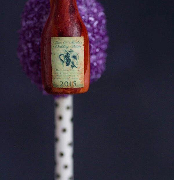 These Wine Bottle Cake Pops are so fun to serve and they can be personalized with your favorite wine label. Everything is edible.