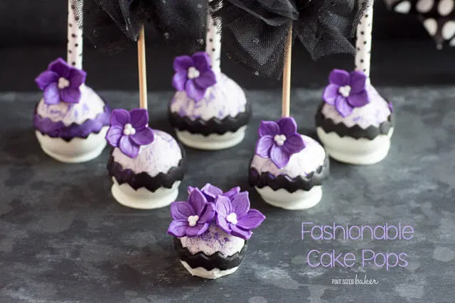 Black and white with a pop of purple! These high fashion cake pops are sure to please the most fashionable girl in town!