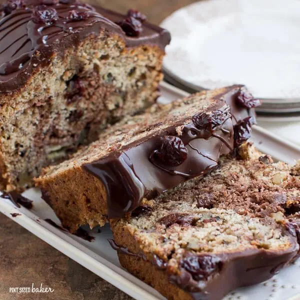 Dried cherries make this banana bread amazing! The chocolate on top just makes it totally decadent.