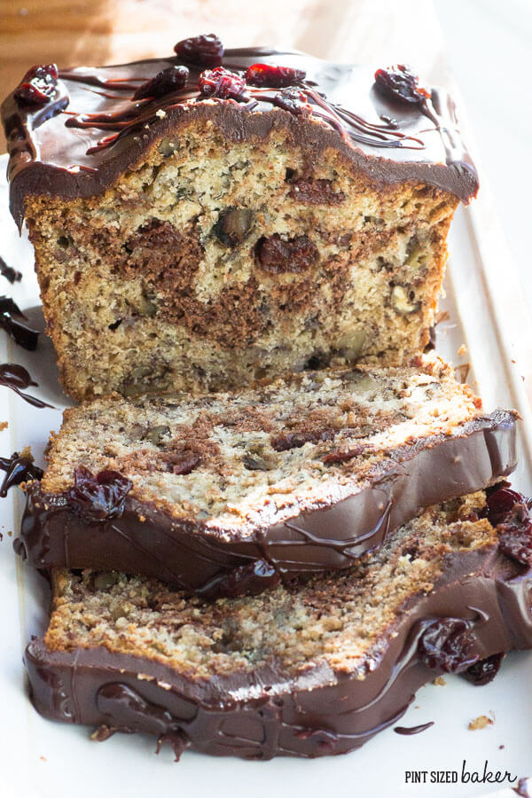 Chocolate Cherry Banana Bread is spiked with dried cherries and toasted walnuts then covered in chocolate! 