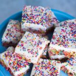 The kids LOVE these fun and colorful Fruity Pebbles Bars with a generous layer of vanilla frosting and covered in rainbow sprinkles.