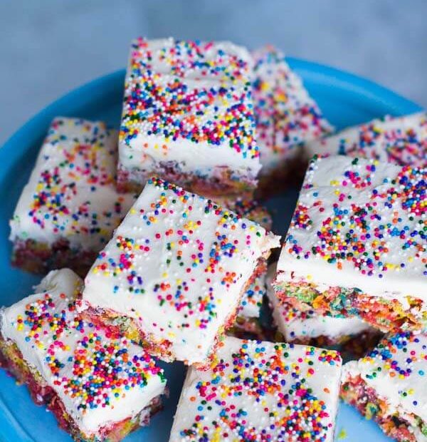 The kids LOVE these fun and colorful Fruity Pebbles Bars with a generous layer of vanilla frosting and covered in rainbow sprinkles.