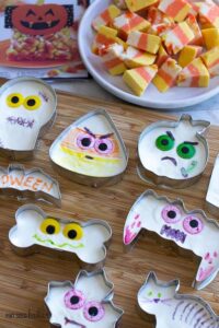 What a great idea! Use Halloween cookie cutters and fill them with easy fudge. Then let the kids decorate them any way they want.