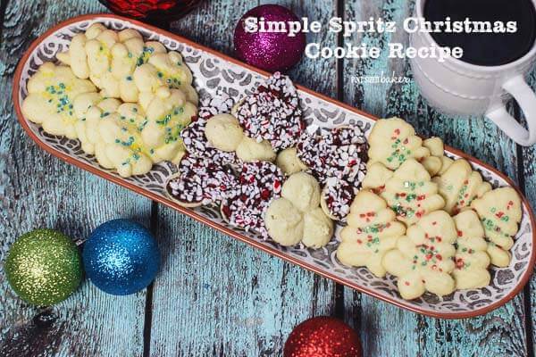 Simple Spritz Cookie Recipe decorated with some fun sprinkles or dip them in chocolate and add candy cane bits. They were amazing!