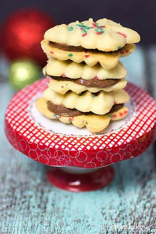 Make some Simple Spritz Christmas Cookies with the kids. Enjoy them one cookie at a time or turn them into cookie sandwiches!