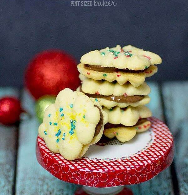 Simple Spritz Cookie Recipe with some fun sprinkles and then sandwiched with Rolo candies. They were amazing!