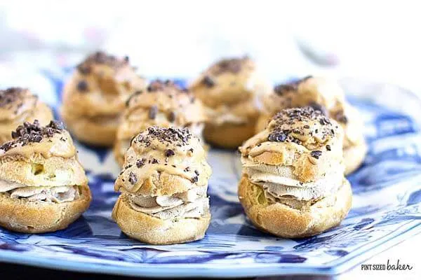 Pastry Puffs full of coffee whipped cream and a coffee glaze and topped with chocolate covered coffee beans. They are so good!!