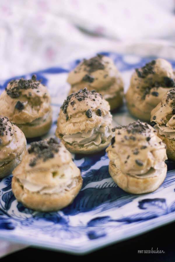 Easy Pastry Puffs full of coffee whipped cream and a coffee glaze and topped with chocolate covered coffee beans. They are so good!!