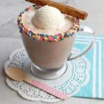 Horchata hot chocolate float with ice cream in a glass