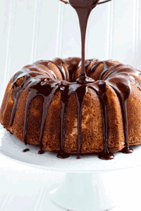 Pour on the chocolate ganache! This homemade butter pound cake looks amazing!!