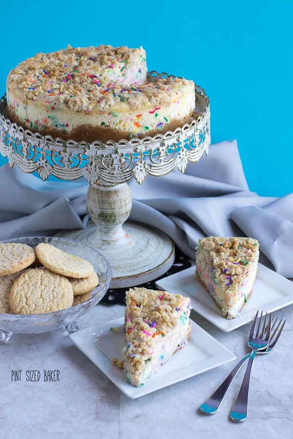 Cheesecake with a sugar cookie crust and cookie crumble topping with sugar cookie batter mixed into it. What a delicious dessert for my next celebration.