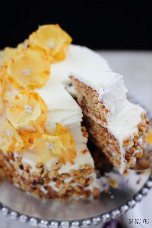 Homemade Hummingbird Cake made with pineapple buttercream and dehydrated pineapple flowers.