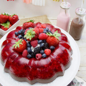 Serve up a smile with this Strawberry and Chocolate Jello Mold. Served with whipped cream and fresh berries, this dessert is going to knock your socks off!