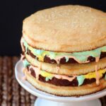 Surprise the men in your life with this fun and delicious Big Mac Cake! It's Three layers of Yellow Cake with Fudgy Brownies and seven minute frosting.