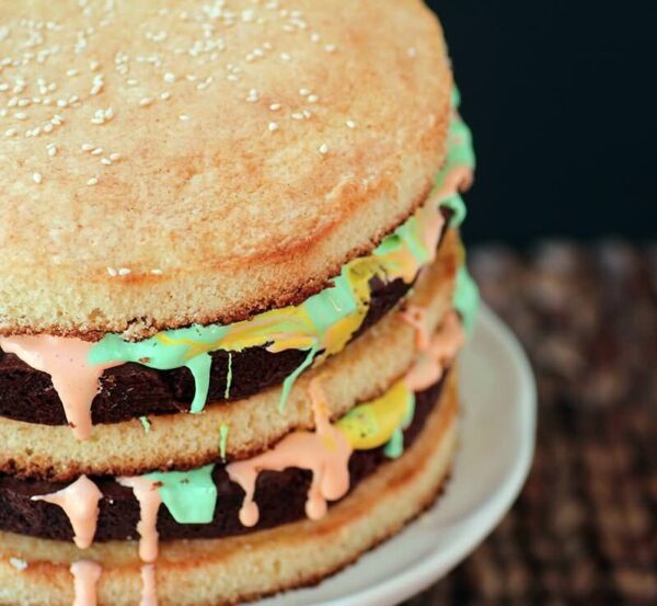Two fudgy brownies, special frosting, and yellow cake make up this AMAZING Big Mac Cake!