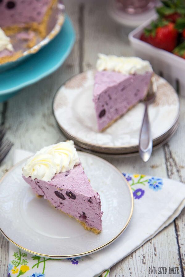 Blueberry Frozen Yogurt Pie is perfect for summer. It's a quick and easy no churn way to make a frozen yogurt pie!