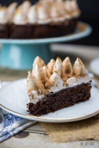Thick and fudgy Hot Chocolate Brownie with a chocolate layer and topped with toasted marshmallow frosting.
