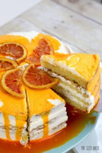 Slicing into this cake reveals four layers of Orange Olive Oil Cake.