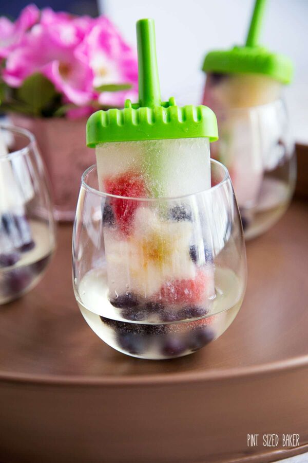 Sweet white wine spritzer popsicles are a perfect way to beat the heat this summer.