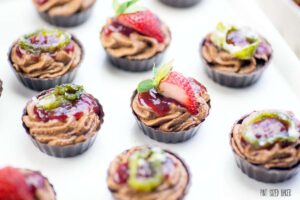 Sugared Jalapeno and fresh strawberries top these sweet heat chocolate mousse cups.